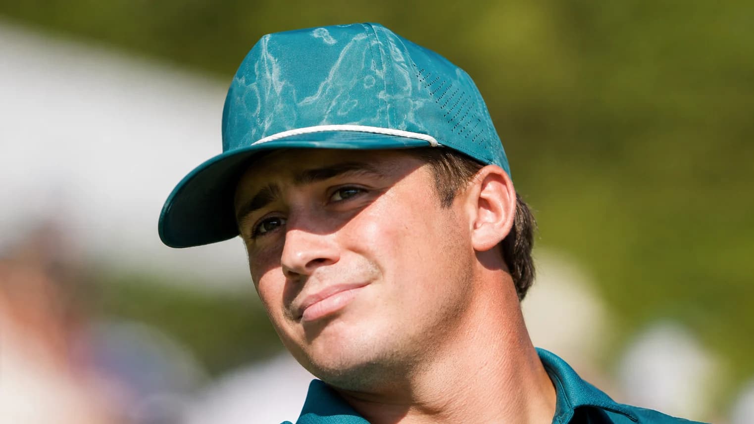 Good Good co-founder Garrett Clark wearing a turquoise cap and polo