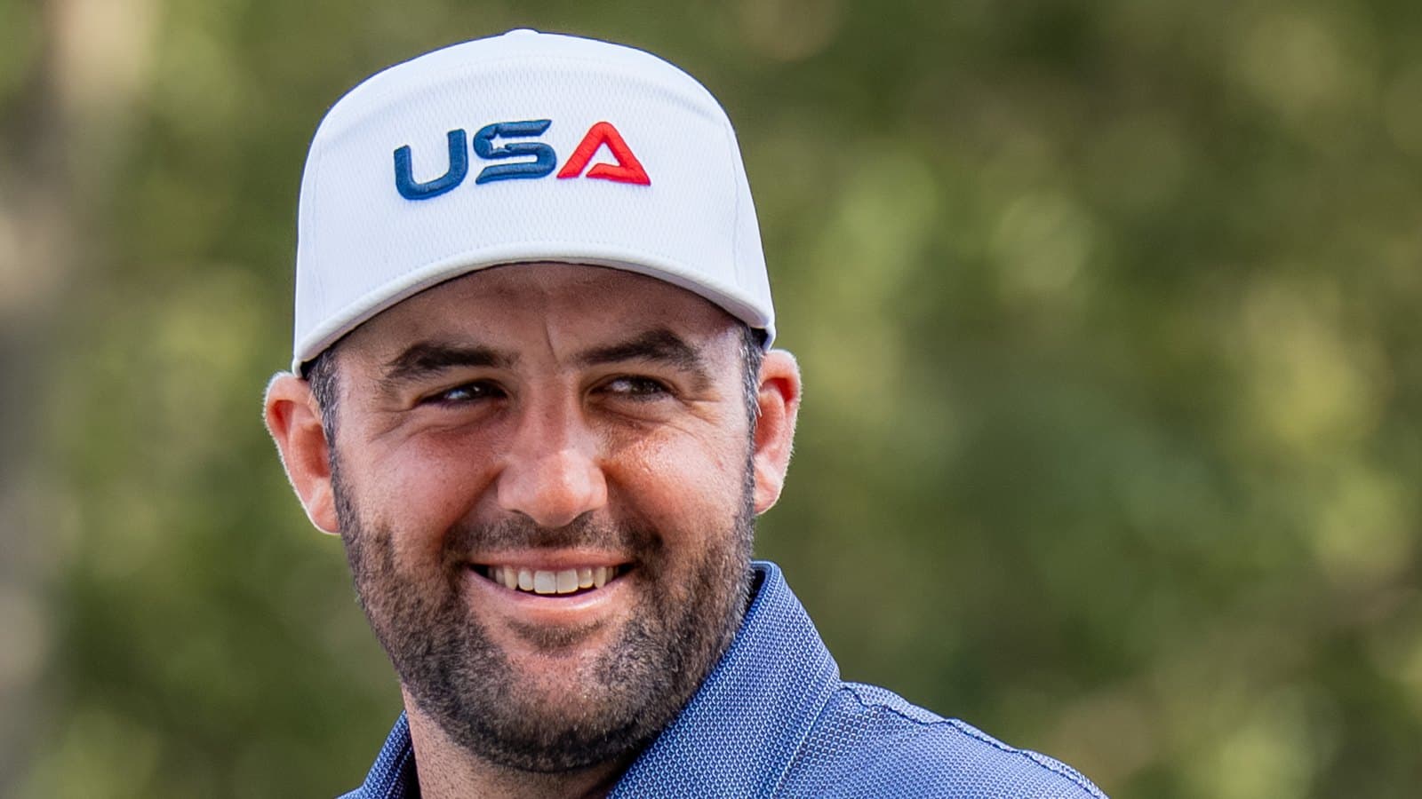Scottie Scheffler smiles in Team USA clothing during the 2025 Ryder Cup