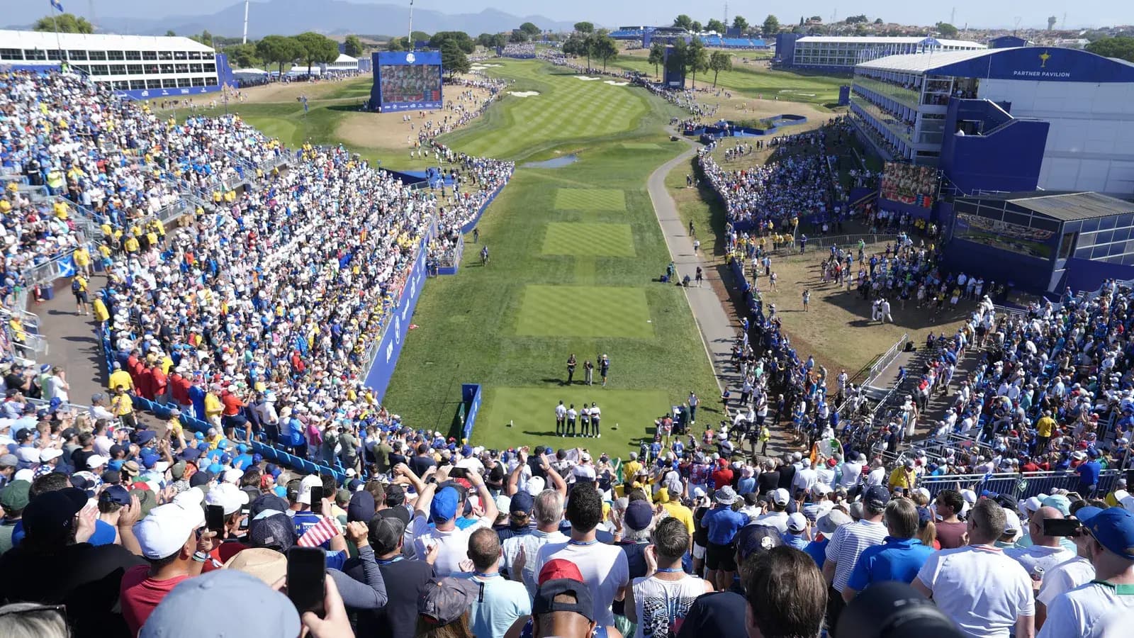 Packed grandstands around the first tee at the 2023 Ryder Cup at Marco Simone