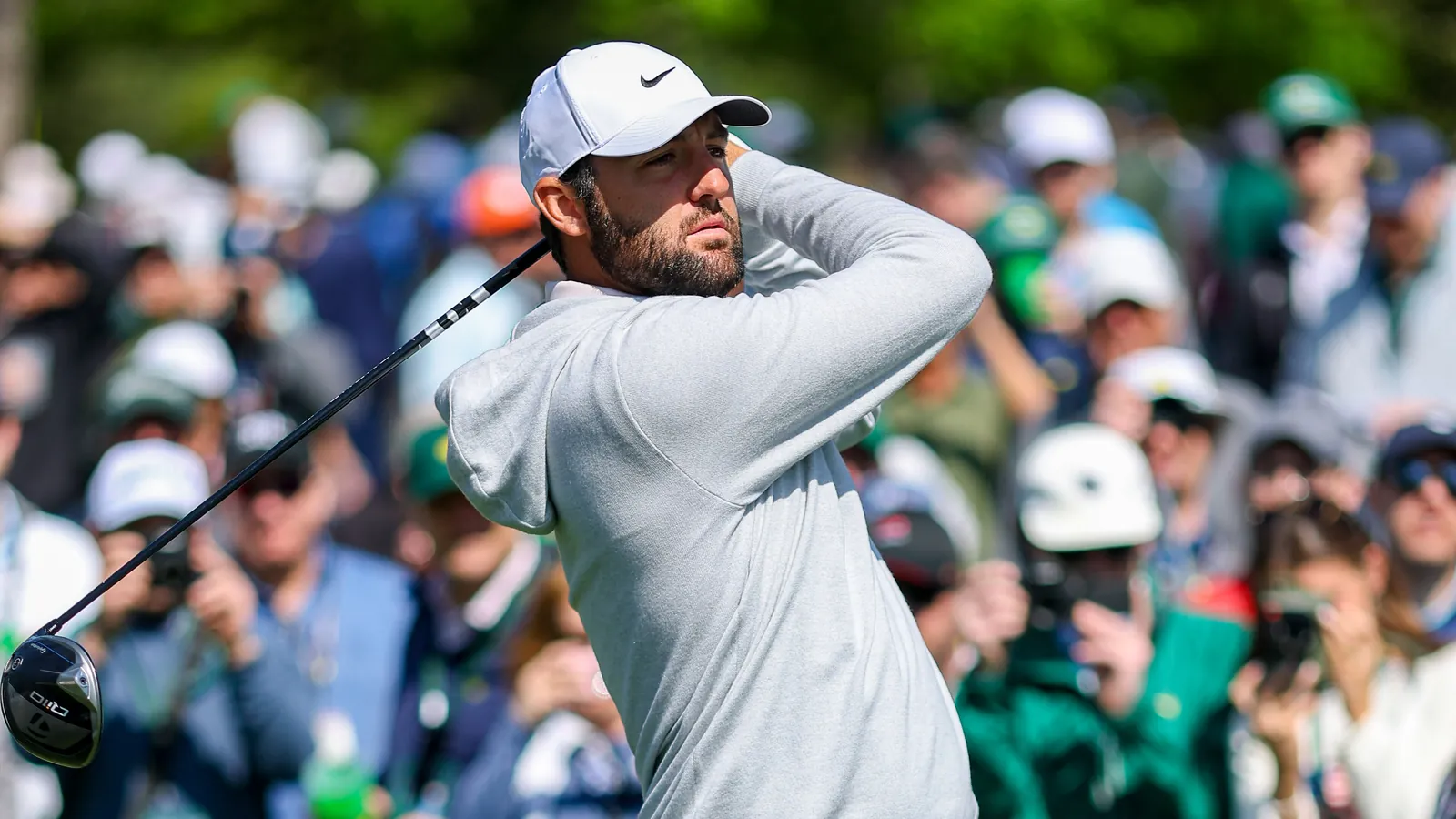 Scottie Scheffler watches his drive during a practice round at the 2024 Masters
