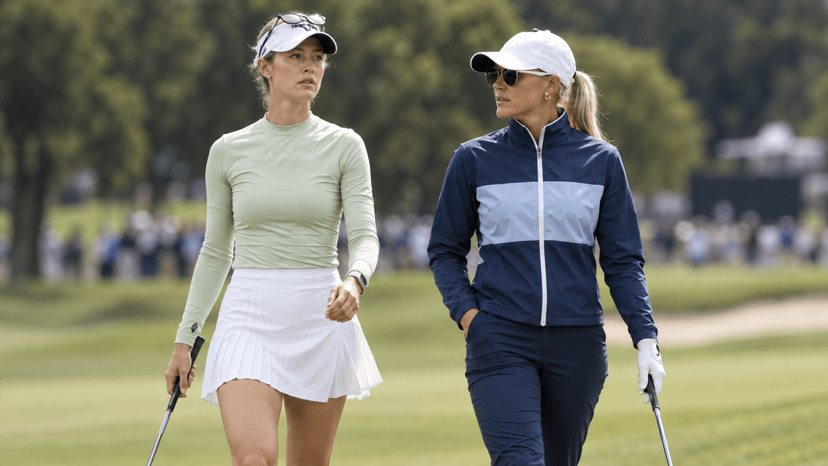 Two professional golfers walking together on a golf course
